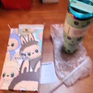 Stanley Tumbler with Straw the monsters collection.  Stich light green in color.